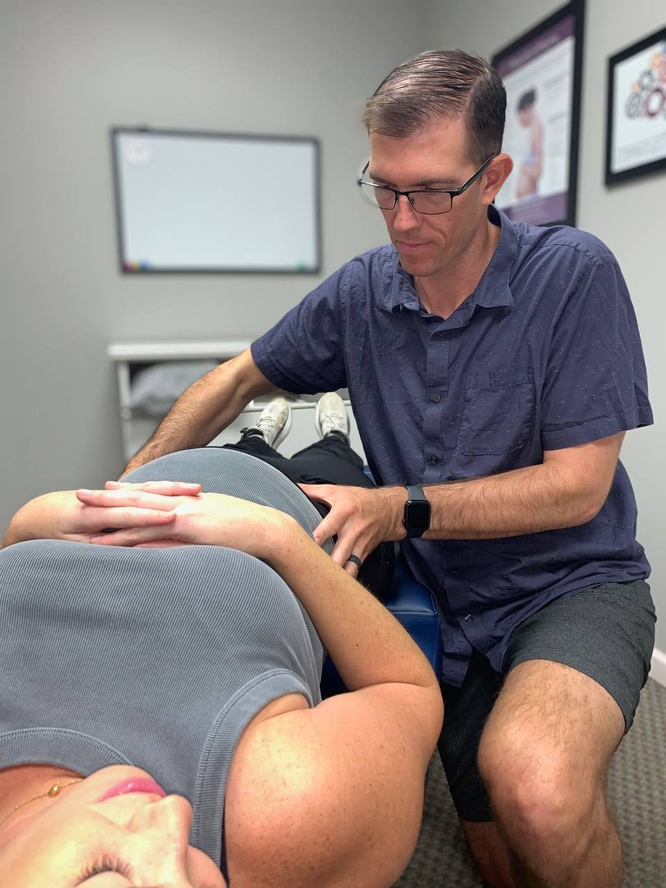 Dr. Craig Raschke providing gentle pregnancy chiropractic care at Adopt Chiropractic